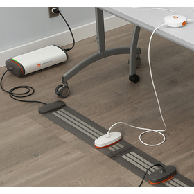 In context view of the Juice Mobile Power system integrated into a room and table