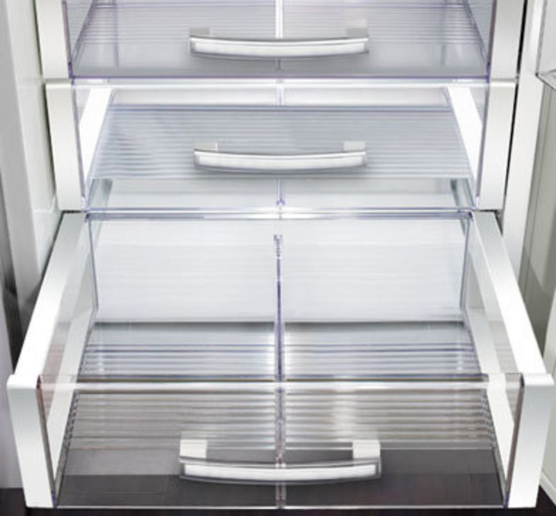 Close up of clear plastic crisper drawers