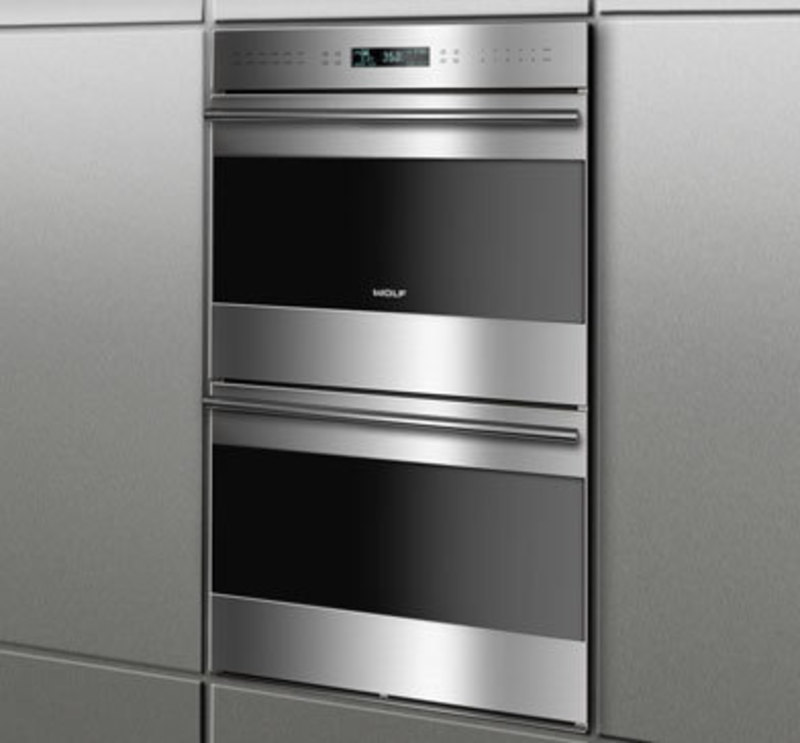 Wolf Appliance, Inc.: E Series Built-In Wall Ovens, Unframed Door Style Rendering of two stacked ovens built into a wall