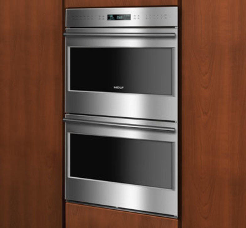 Wolf Appliance, Inc.: E Series Built-In Wall Ovens, Framed Door Style Two stacked frame style ovens built into a wall