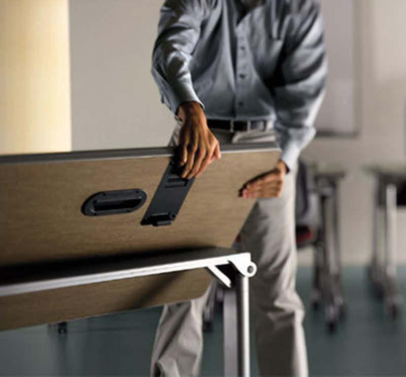 Allsteel Inc.: Get Set Table Image showing a user folding a Get Set table