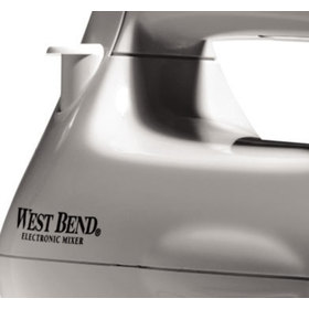 Detail view of the west bend stand mixer showing its release button and West Bend logo