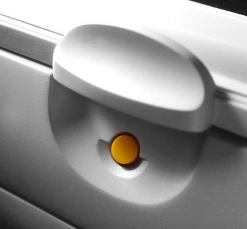 Close up view of the molded-in detail around the button on the front of the unit