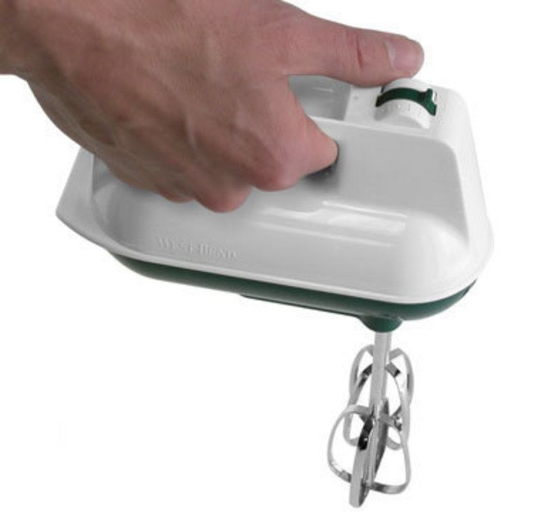 West bend Hand Mixer in a user's hand showing control accessibility