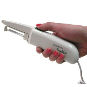 Side view of the Power Peeler in a user's hand
