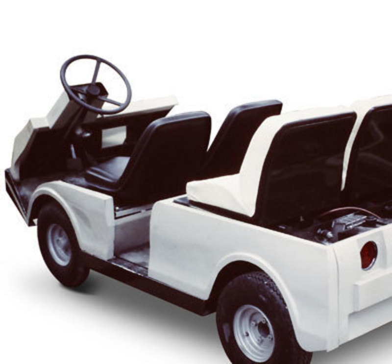 Three quarters rear view of the Cushman turf-care vehicle showing the seat backs and controls