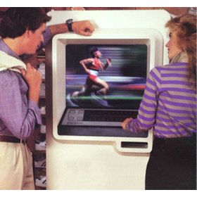 Promotional image showing two end-users using the Videospond kiosk