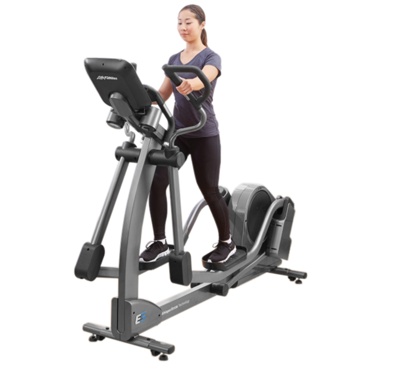 Three quarters view of an e-series elliptical with a person using it