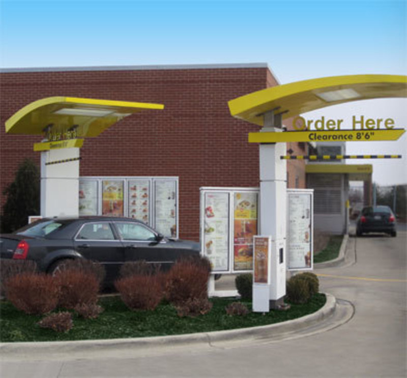 Keyser Visual: McDonald's Outdoor Menu Boards Drive-Thru System Menu boards in context in drive-through lane with a car next to them