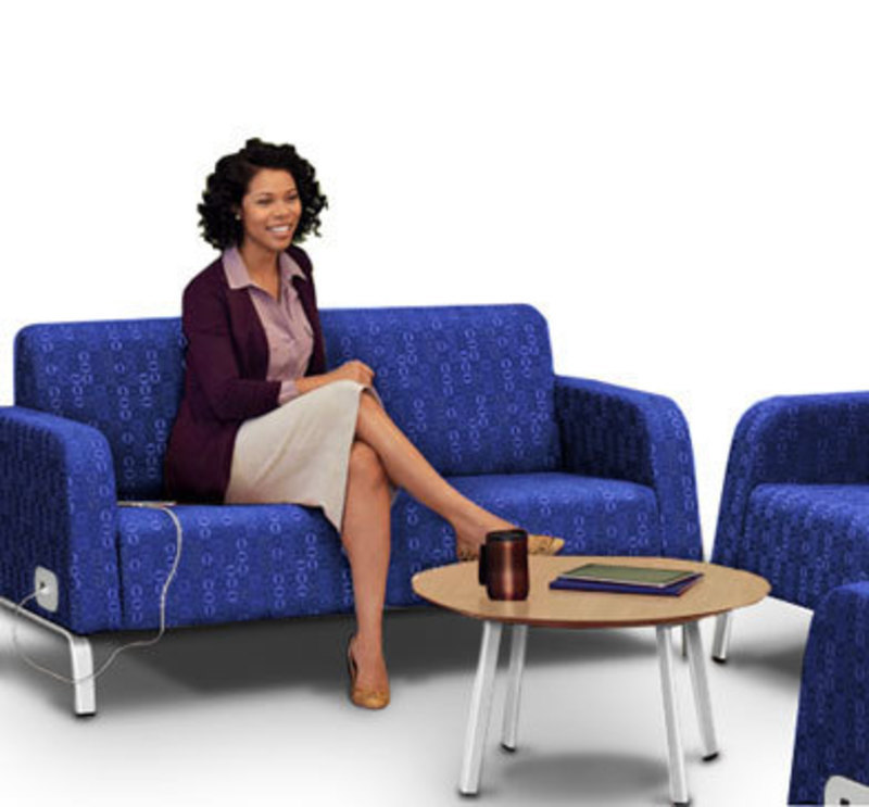 In context view of a Motiv Modular love seat with a woman sitting 