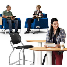 In context view showing people using Motiv cafe tables and soft chairs