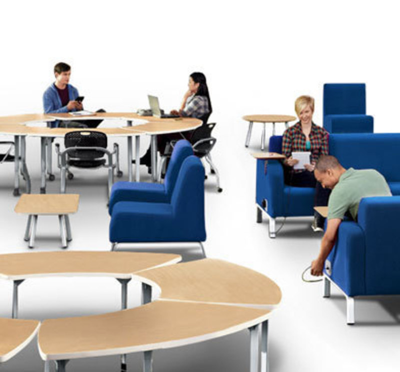 In context view showing people in Motiv soft chairs and using modular tables
