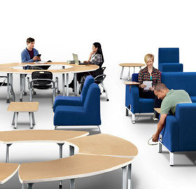 In context view showing people in Motiv soft chairs and using modular tables